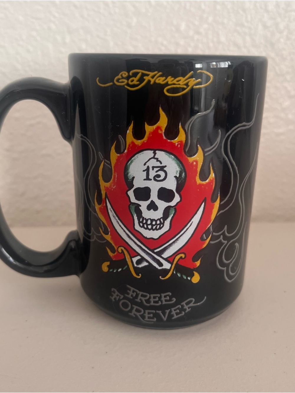 Ed Hardy Black Mug with Red and Yellow Flaming Skull Graphic